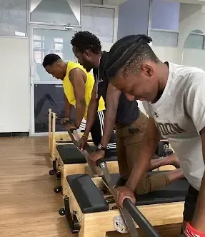 Discover Pilates session with core posture and flexibility focus at Batman Fitness